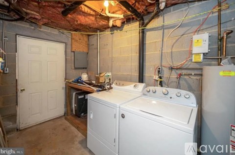 A laundry room with a washer and dryer.