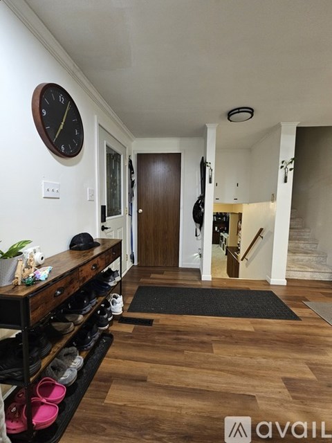 A bathroom with a toilet, sink, and shower curtain.
