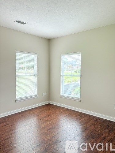 A white toilet sits next to a sink in a bathroom.