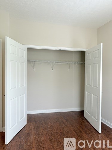 A house with a garage and a driveway in front.