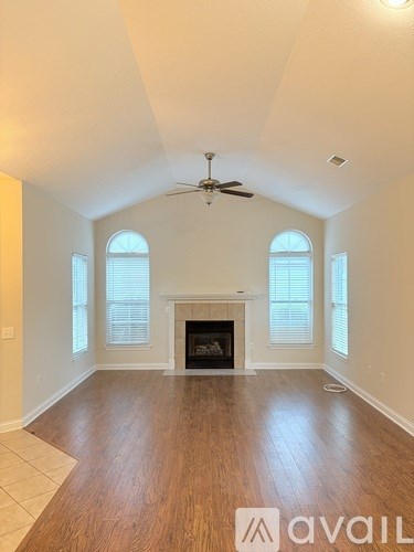 A house with the number 520 painted on the front wall and a black door.