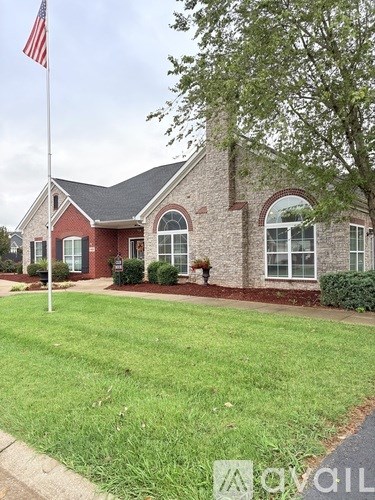 A house with a flag on a pole in front.