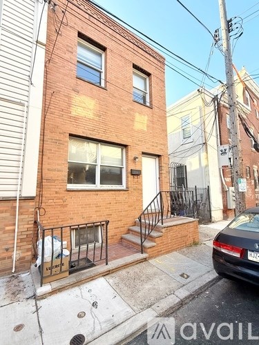 A brick building with a window and a door.