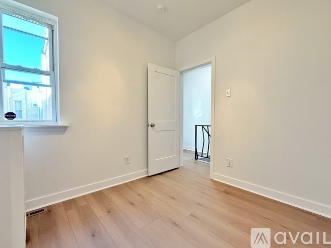 A room with a door and a window.