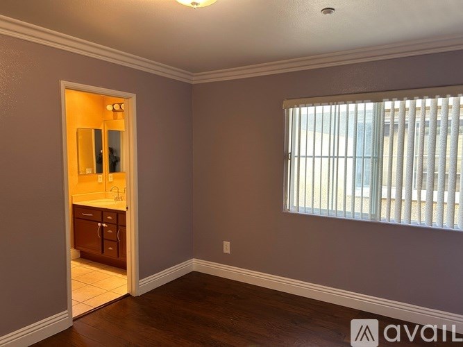 A staircase with a white railing and a marble floor.