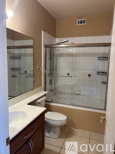 A living room with a piano and a television.
