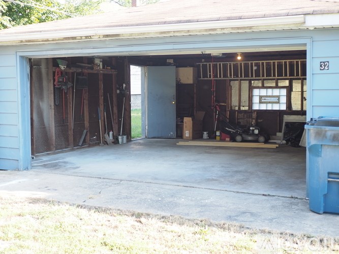 A garage with the number 32 on the door.