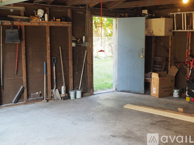 A garage with a lot of tools and equipment.