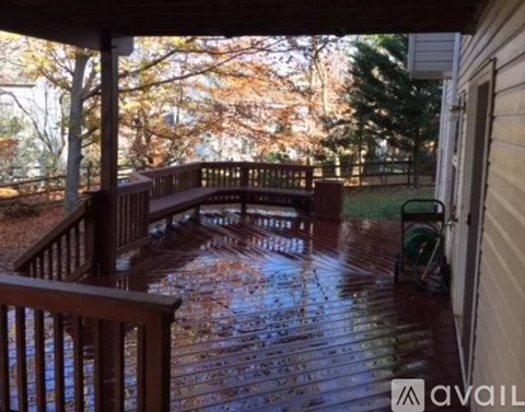A modern kitchen with black cabinets and a black dishwasher.