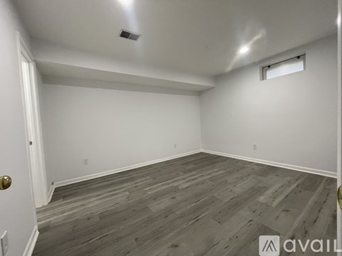 A bathroom with a toilet, sink, and walk-in shower.