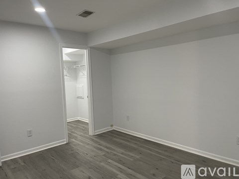 A room with a doorway leading to another room.