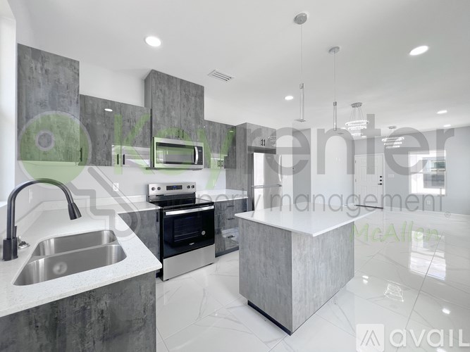 A modern kitchen with a sink, stove, and oven.