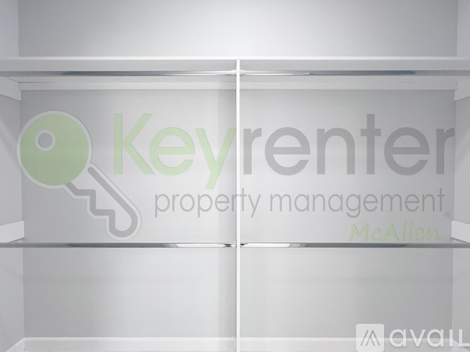A glass shelf with a logo for Keyrenter Property Management on it.