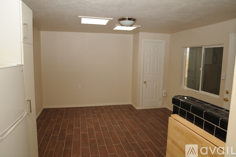A room with a tiled floor and a window.