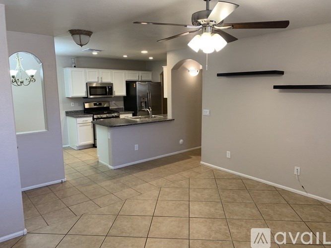 A kitchen with a fan and a countertop.