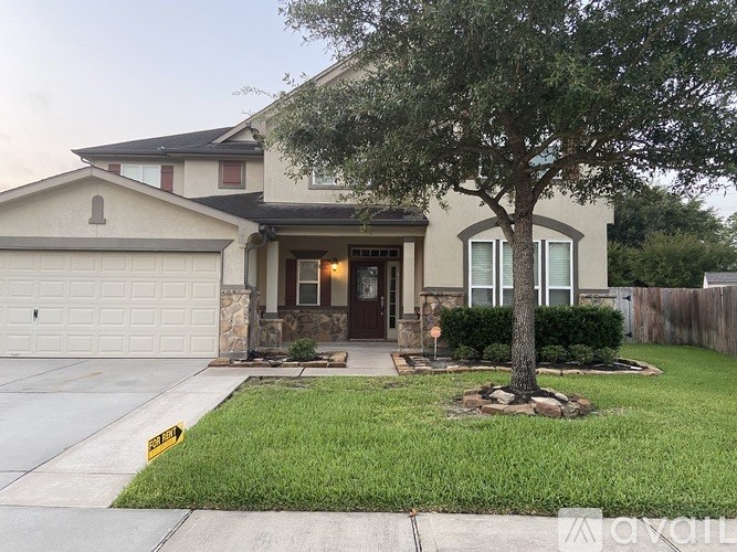 A house with a tree in front of it.
