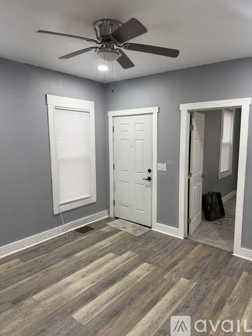A room with grey walls and a window.