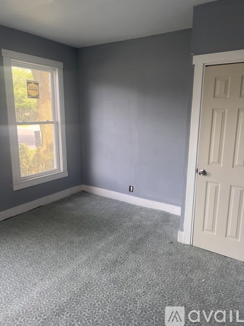 A room with a door and a window.