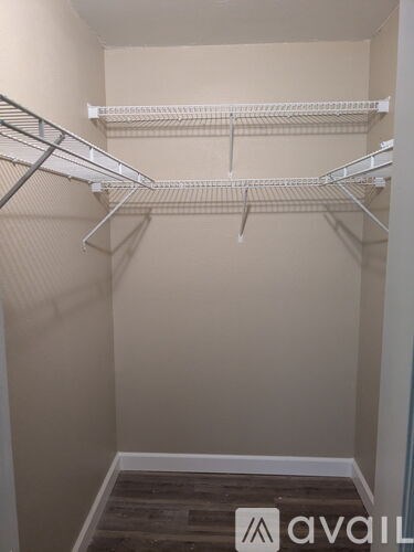 Empty white shelves in a room.