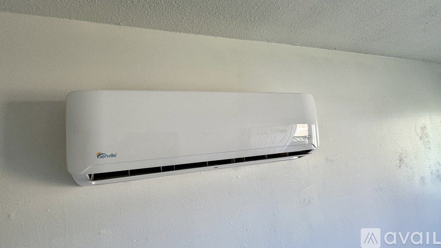 A white wall-mounted air conditioner with the text "Ge" visible on it.