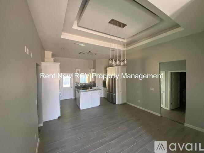 A spacious room with a kitchenette and a dining area is available for rent.