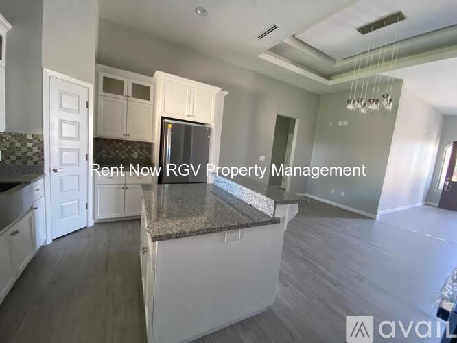 A kitchen with a countertop and cabinets is on the market with RGV Property Management.
