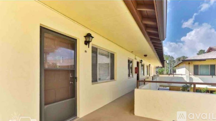 A house with a balcony and a window is available for rent.