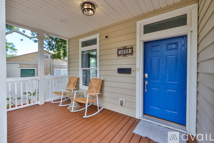A blue door is on the right side of the house.