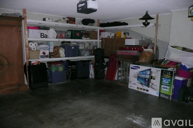 A room with a lot of clutter and a box that says Avail.