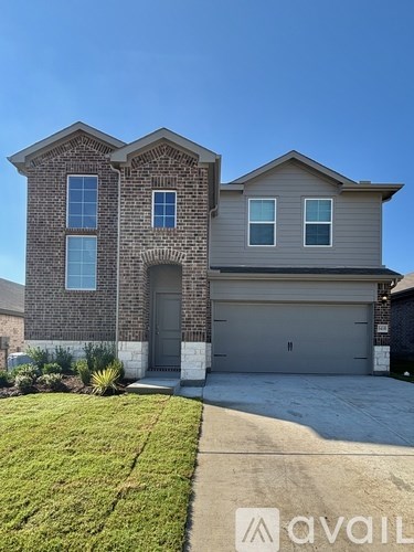 A two-story house with a garage is for sale.