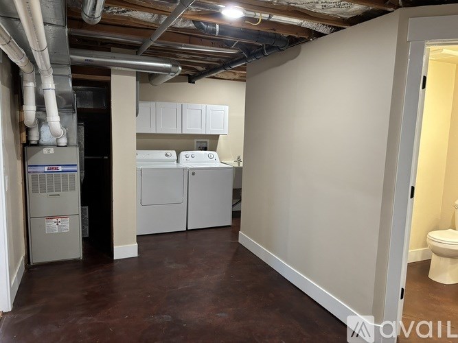 A room with a washer and dryer in it.