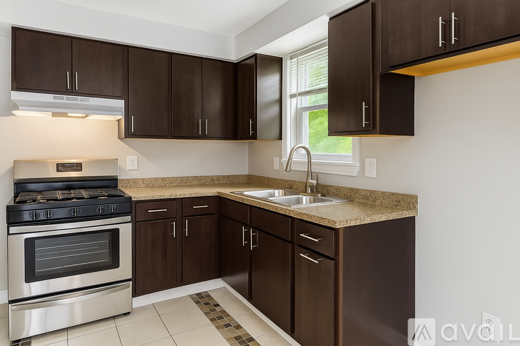 A kitchen with brown cabinets and a stove top oven.
