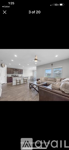 A living room with a couch and a coffee table.