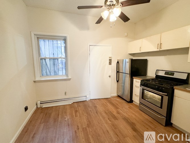 A kitchen with a stove, oven, and refrigerator.