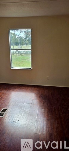 A bathroom with a sink and a mirror.
