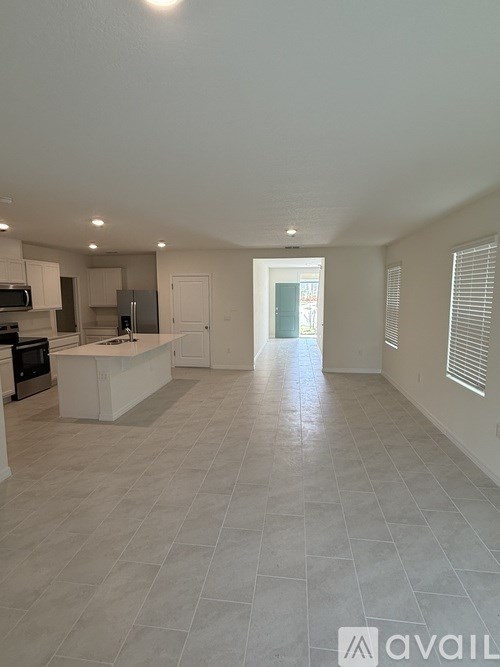 A spacious kitchen with a countertop and a microwave.