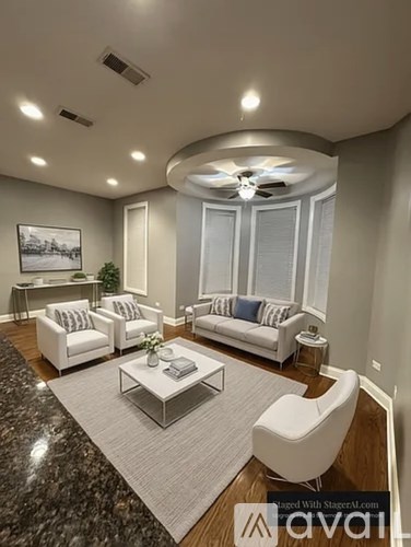 A modern living room with a marble floor and white furniture.