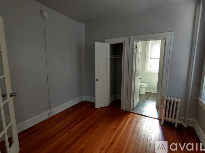 A room with wooden floors and white walls.