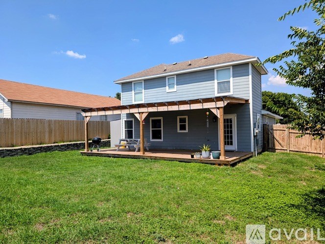 A house with a porch and a covered patio.