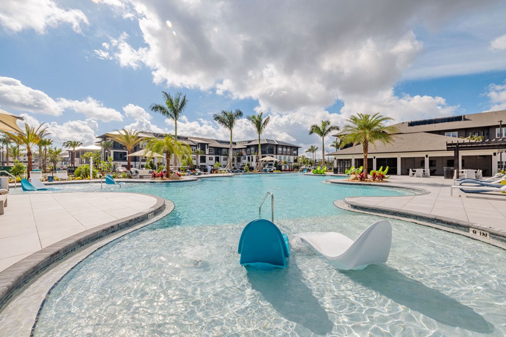 A large swimming pool with a blue and white float in the middle.