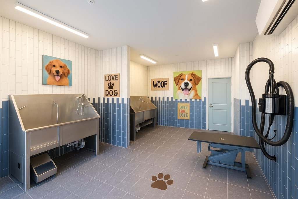 A dog grooming area with a bench and a dog paw print on the floor.