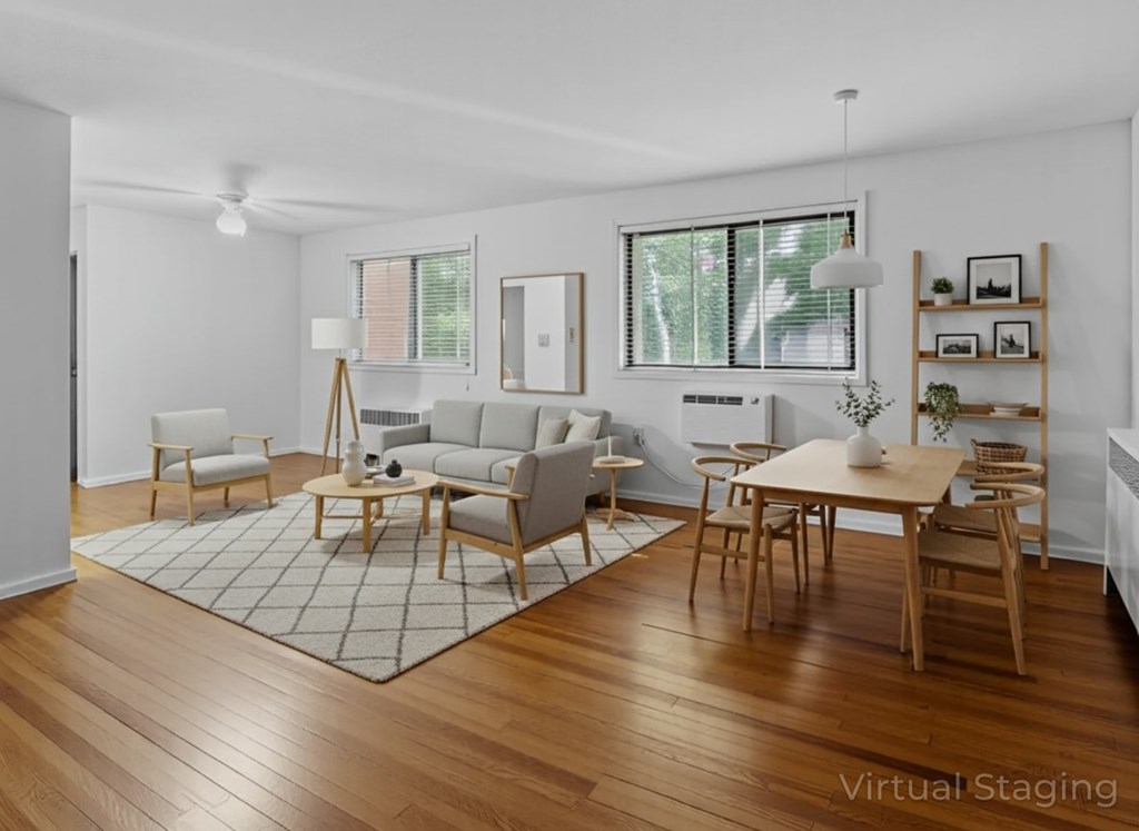 A living room with wooden floors and furniture.
