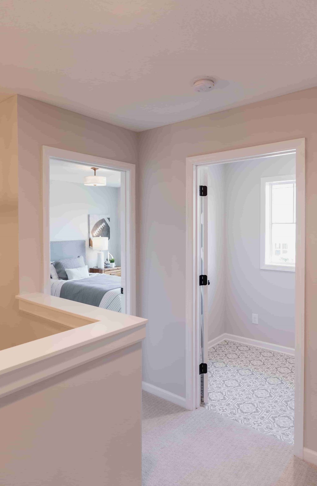 A white bathroom with a tub and a door.
