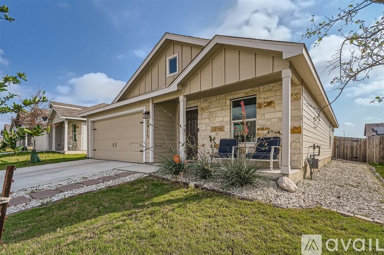 A house with a garage and a driveway in front.