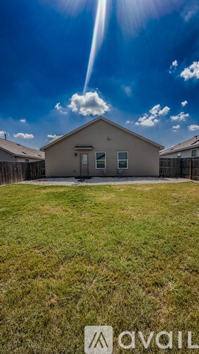 A house with a sunbeam in the sky.