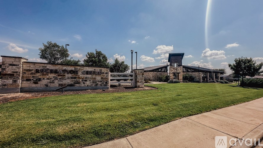 A building with a grassy area in front of it.