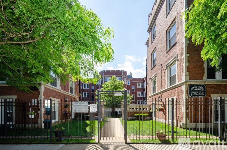 A gated entrance to a brick building with a sign that reads "Annenberg.".