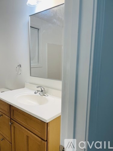 A bathroom sink with a mirror above it.