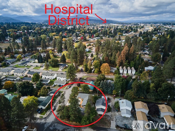 An aerial view of a hospital district with a red circle highlighting a specific area.