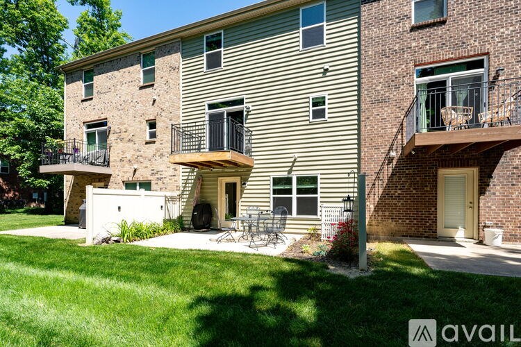 A building with a balcony and a patio area.
